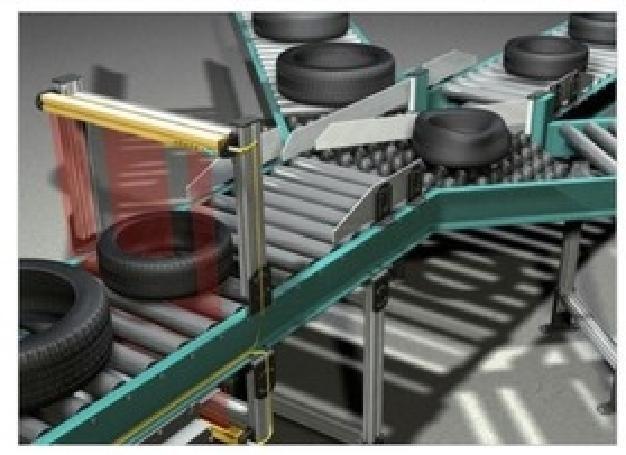 Safety light curtain guarding a tyre conveyor line